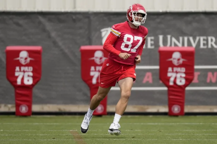 Chiefs Football Kansas City Chiefs tight end Travis Kelce runs during the NFL football team's organized team activities Thursday, May 30, 2024, in Kansas City, Mo. (AP Photo/Charlie Riedel)ASSOCIATED PRESS EASTLAKE, Ohio (AP) — Travis Kelce's power extends beyond the football field or dating one of the world's most famous women. Kansas City's talented tight end, who also happens to be pop superstar Taylor Swift's boyfriend, showed off his batting skills on Saturday by winning a home run contest at a charity softball event hosted by Browns tight end David Njoku. Kelce, who grew up in Cleveland, arrived at Classic Park, home of the minor league Lake County Captains, just as the event was getting underway. As he made his way onto the field, Kelce shook hands with some fans before warmly greeting Browns defensive end Myles Garrett and quarterback Deshaun Watson. Once in the batter's box, Kelce, who played high school baseball, put on an impressive performance. After connecting on his final swing and sending another ball over the fence to clinch the win, Kelce flipped his bat in celebration and took a victory lap around the bases. He was awarded a trophy he'll be able to show to Swift, who is performing concerts in Scotland this weekend. A three-time Super Bowl champion, Kelce has become close in recent years with Njoku, who has attended his offseason Tight End University. “That’s my guy, man,” Njoku said. “He’s one of the purest human beings I’ve met in my life honestly. Always means well. Just great overall dude.” Kelce has always backed Cleveland's baseball team and last year throw out an ill-fated ceremonial first pitch that he spiked like a football. Kelce has stayed busy throughout the offseason. He recently took part in the Chiefs' organized team activities and visited the White House when the Super Bowl champions were hosted by President Joe Biden.